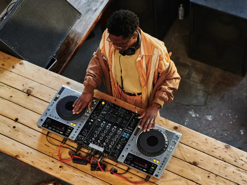 A guy phrase mixing on a dj controller